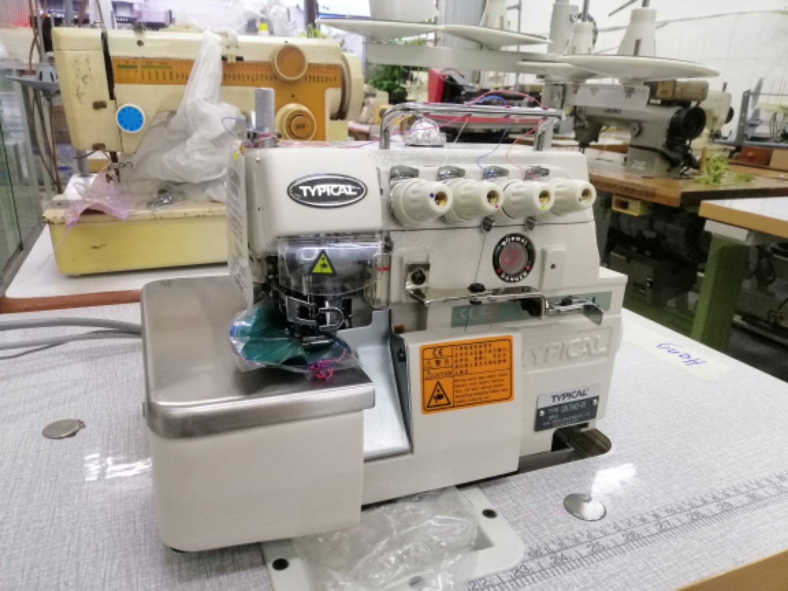 TYPICAL INDUSTRIAL OVERLOCK SEWING MACHINE 