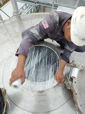 WRAPPING MANHOLE AFTER PASS INSPECTION