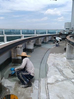 Application of Sika SikaTop Seal 109 base coat in progress