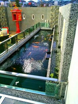 Simple and nice koi pond with clear and clean water.