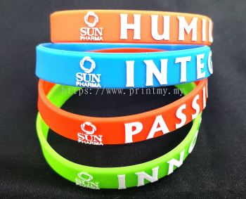 Silicone wristband with emboss wording and logo and fill white color 