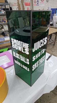 Tinted green acrylic box with white sticker wording