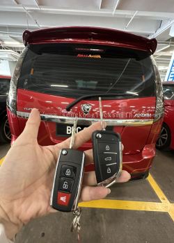 Professional locksmith duplicating car key remote