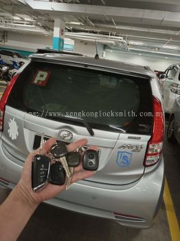 Professional locksmith duplicating car key remote