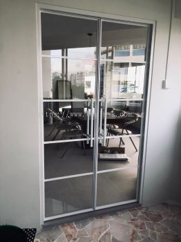 Elegant Double Interior Glass Doors with Lattice Design at Meeting Room