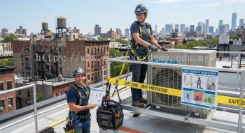 HVAC technician safe access with tools at height