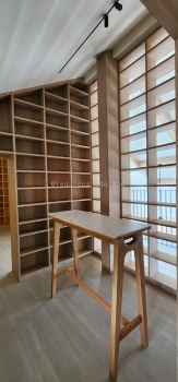 Floor-to-Ceiling Library Shelving with Display Partition